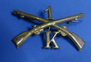 1870's 1st Infantry Co K Lead Filled Cap Badge