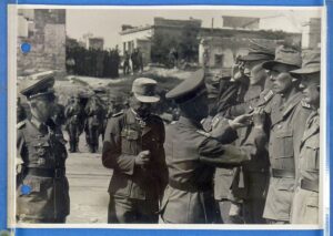 Official WWII German Photograph: A General Presides Over the Award of a Knight's Cross and Iron Crosses