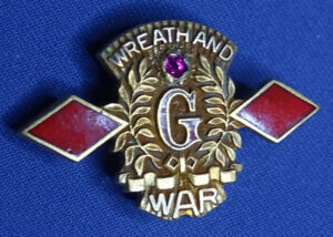 WWII B F Goodrich Co Service Lapel Pin "Wreath And War" - Josten 1/10 GF