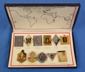 A Cased Set of 11 French Foreign Legion Unit Badges by J. Balme
