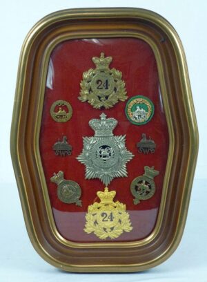 A Framed Display of British Badges of the 24th Foot South Wales Borderers of Rorke's Drift