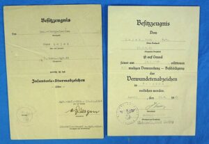 A Pair of WWII German Award Documents for the Wound Badge and Infantry Assault Badge to a Grenadier